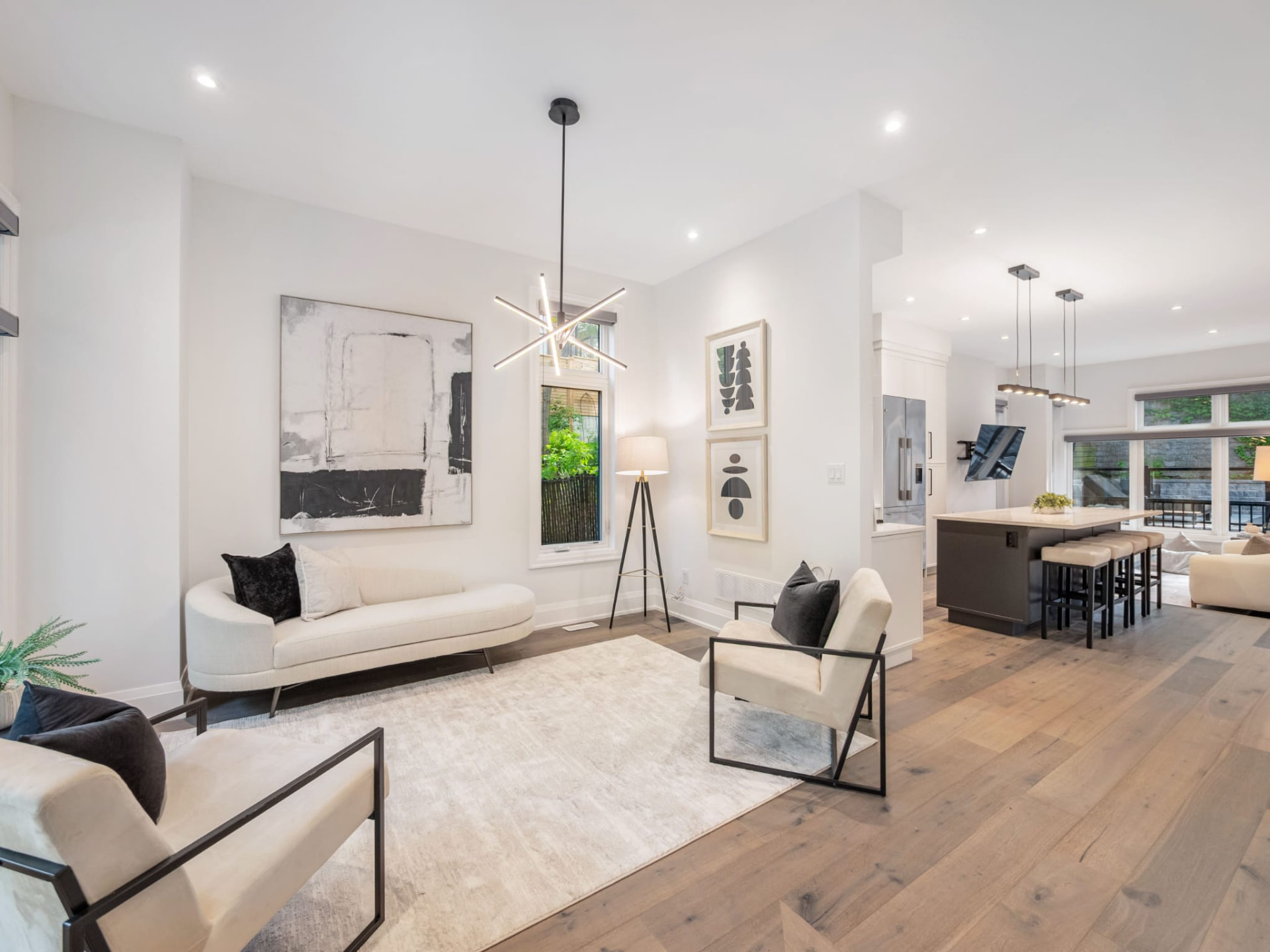 Open plan living and kitchen with pale oak floors